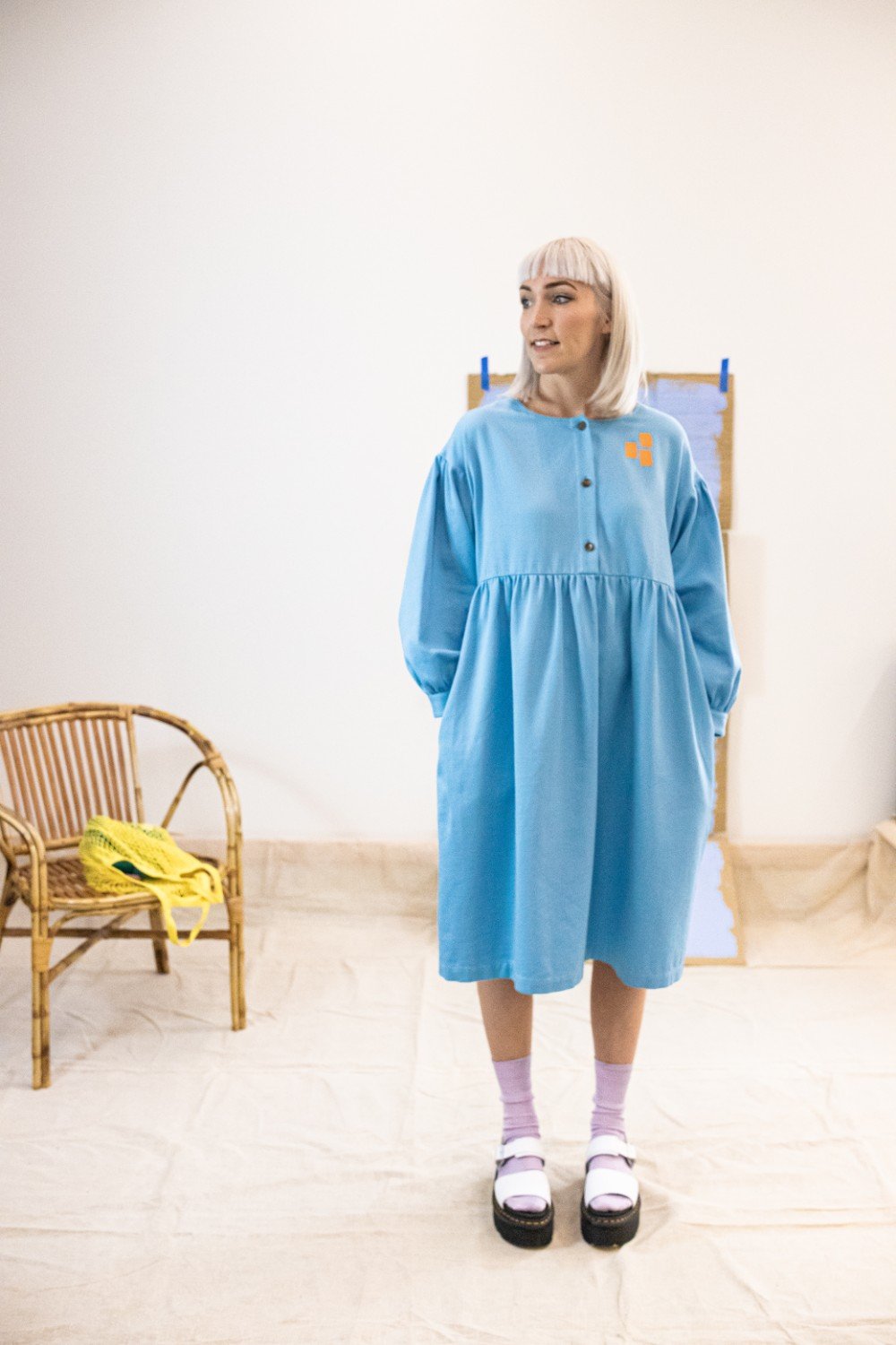 Female model wears Cub and Pudding oversize smock dress in creative studio