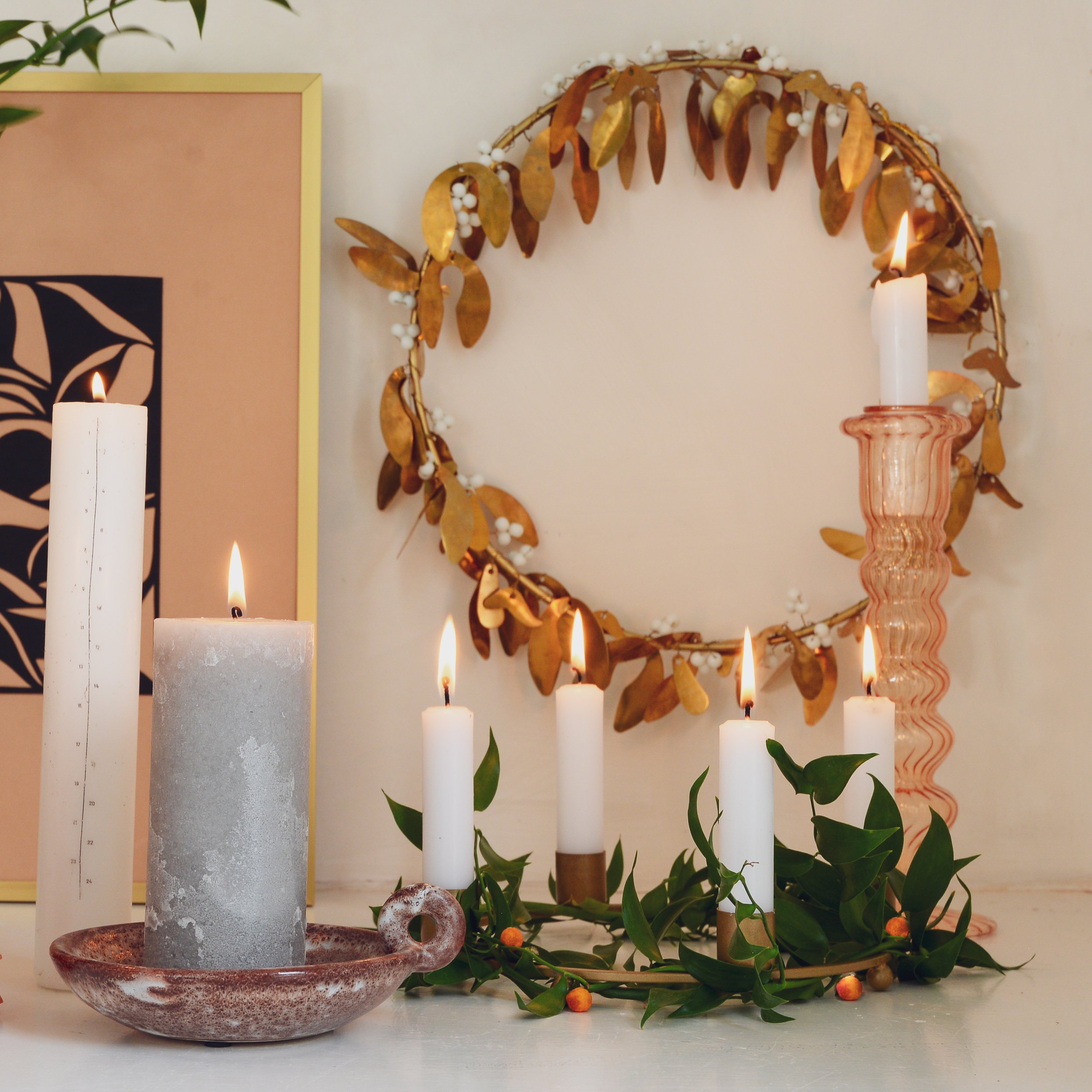 Christmas candles and gold wreath