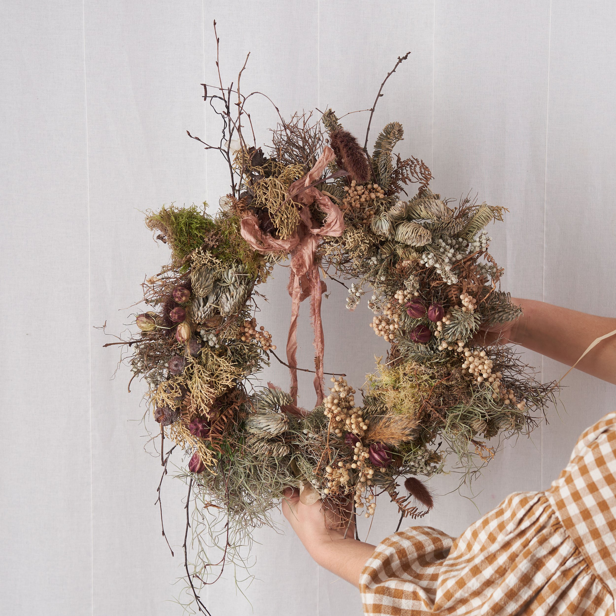Beautiful rustic floral wreath in muted colours