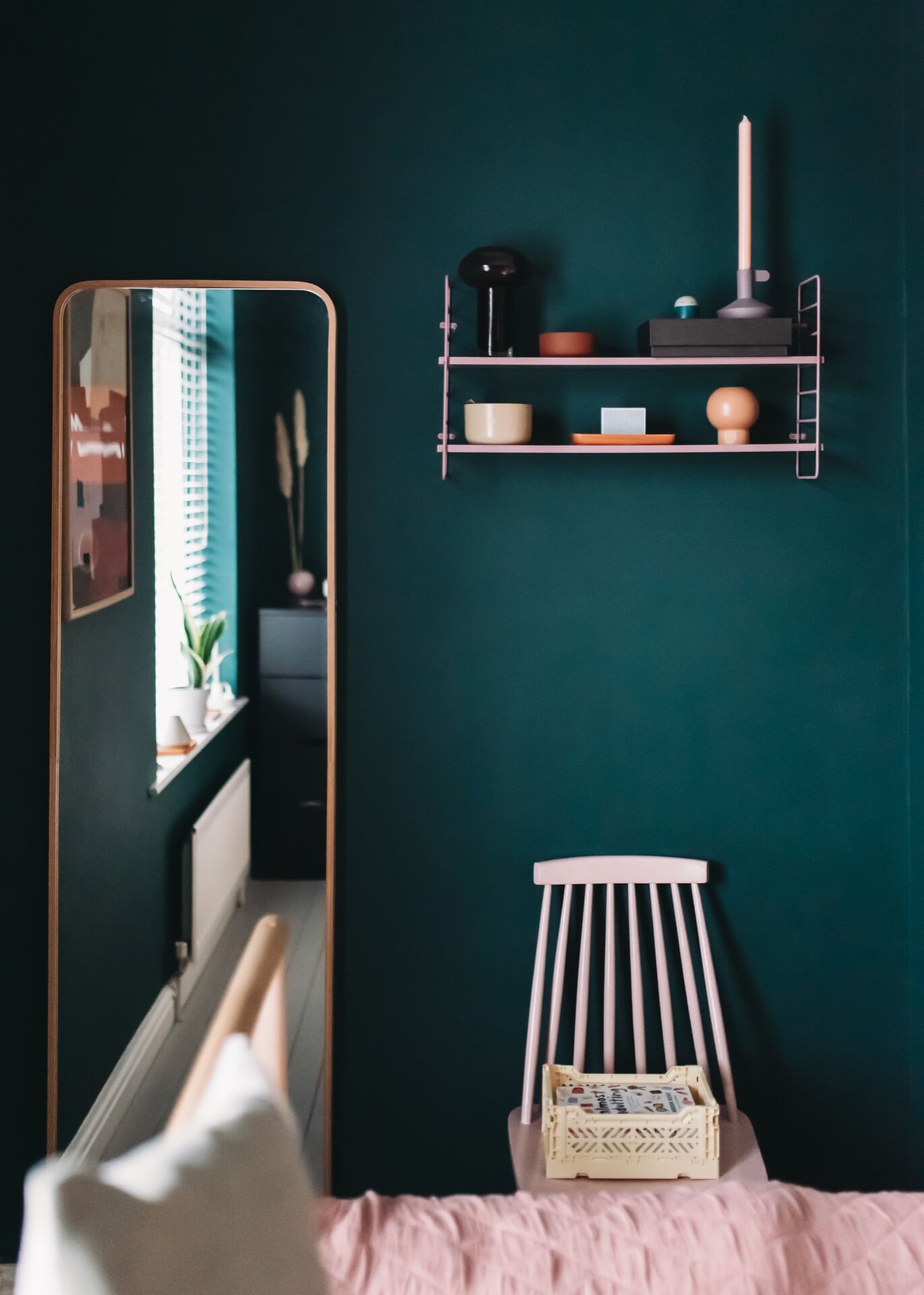 Dark green bedroom with minimalist styling
