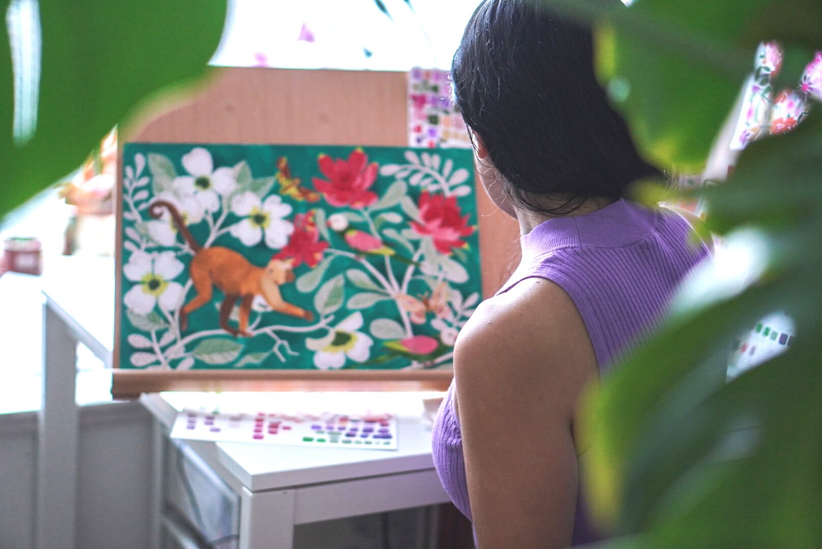 Gina Maldonado in her Hong Kong studio with her colourful, nature-inspired paintings and prints