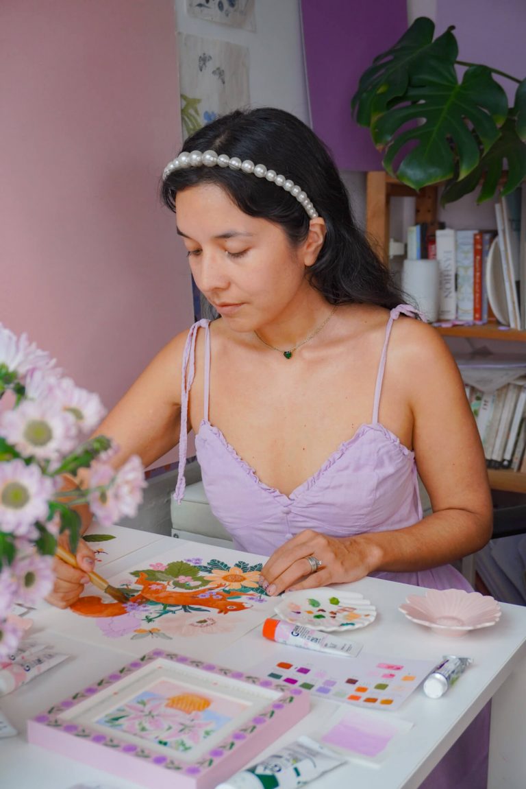 Gina Maldonado in her Hong Kong studio with her colourful, nature-inspired paintings and prints