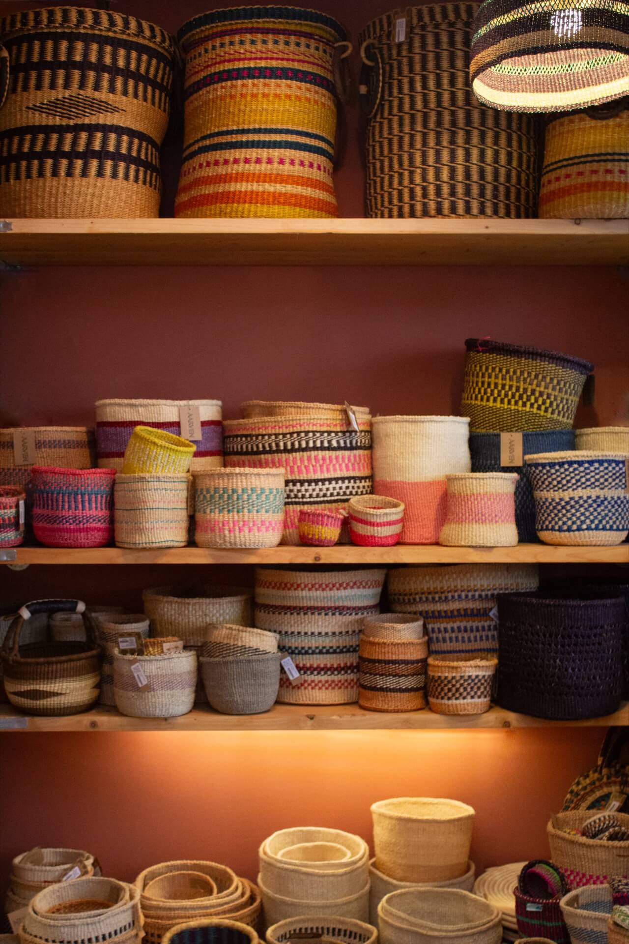 Woven baskets inside ethical homeware and jewellery store AARVEN, Margate