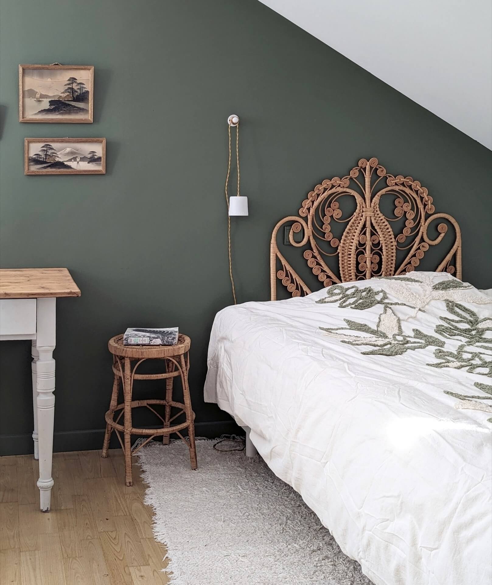 bohemian style bed headboard, in a dark green bedroom