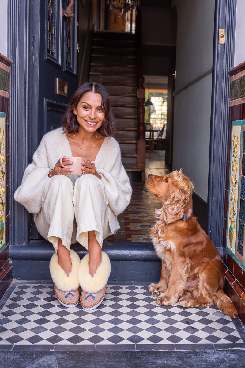 Ayshea of The Small Home on front step wearing The Small Home slippers with her beloved dog