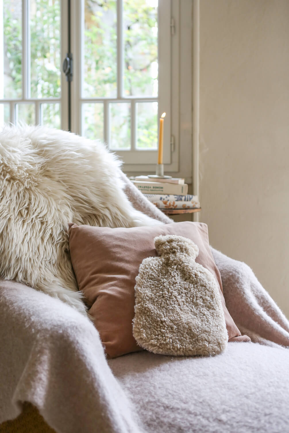 Cosy corner featuring candle by The Small Home